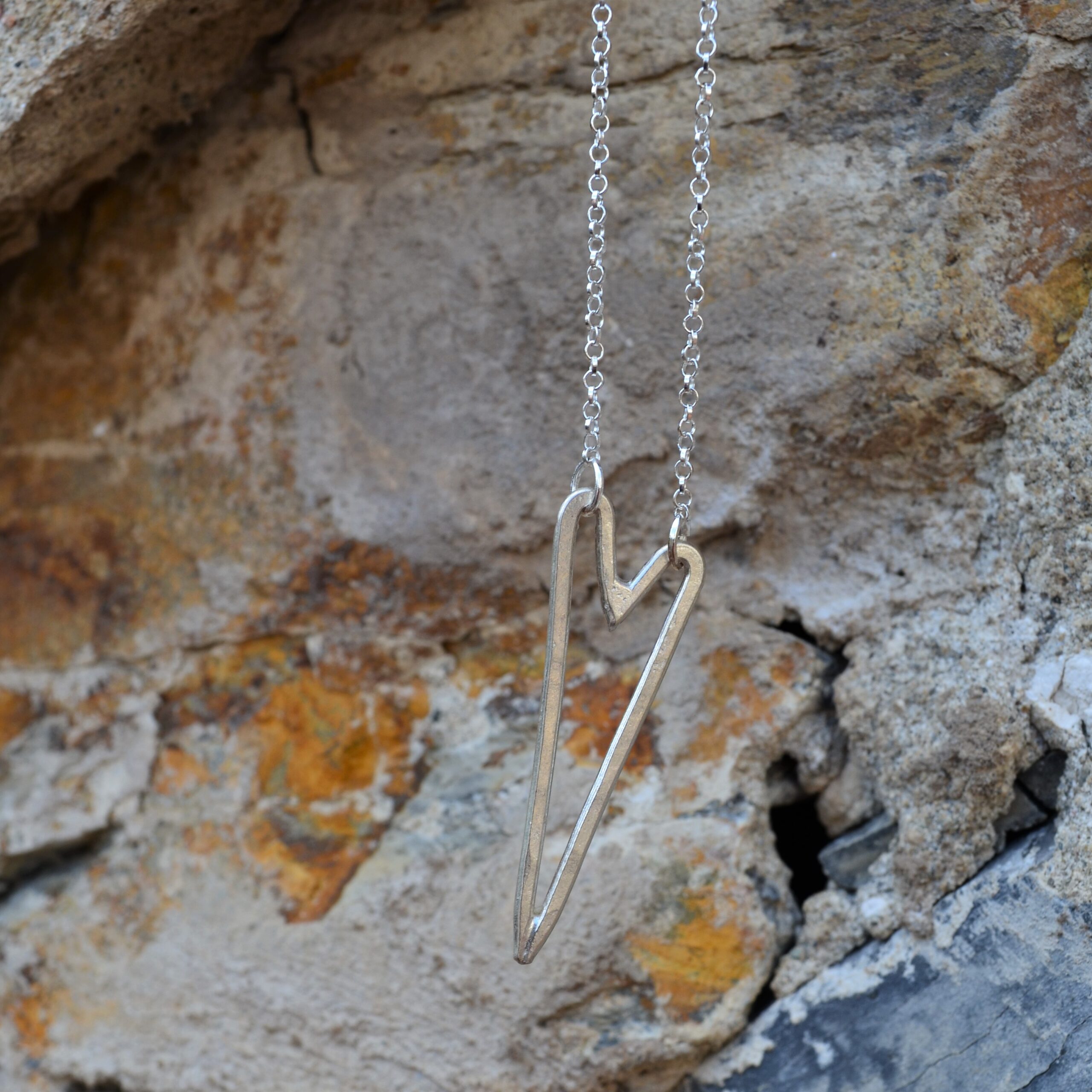 N085 Long Lumo Heart Necklace. Asymmetrical long line silver heart pendant necklace. Fair trade, handmade