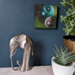 'Dadad and Me' mounted print of a father and child elephant couple in green and blue hues