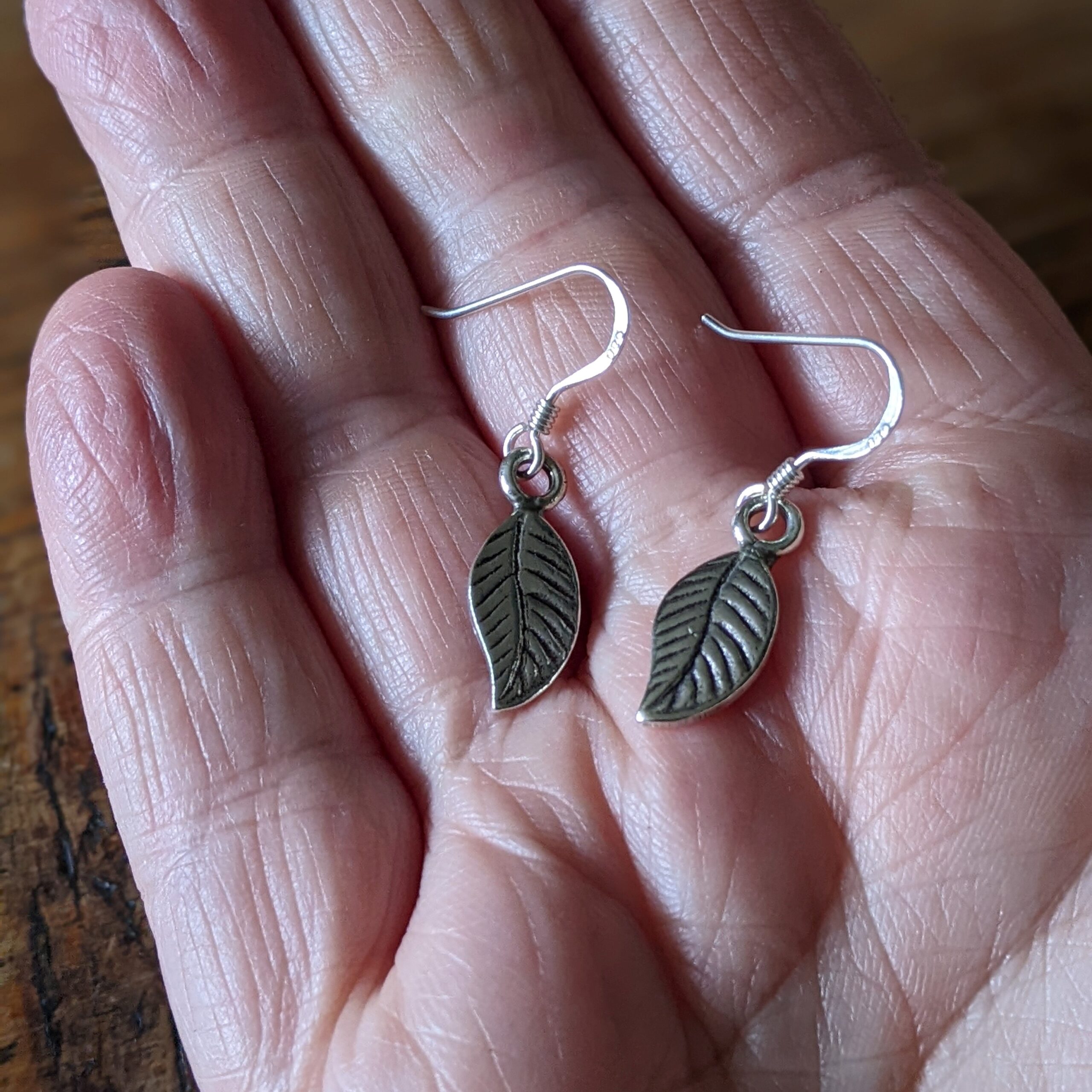 E149 Dakota Earrings. Small fine silver Leaf shaped earrings. Dangle and drop. Handmade, Fair Trade