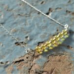 Solar Plexus Chakra, Citrine Trapeze necklace. Horizontal central bar with yellow, citrine gemstones and silver beads on a recycled sterling silver chain. Fair Trade, fine silver, handmade