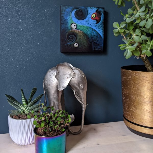 'Hey There Little Fella' is a mounted art print of a flying bird and two elephants