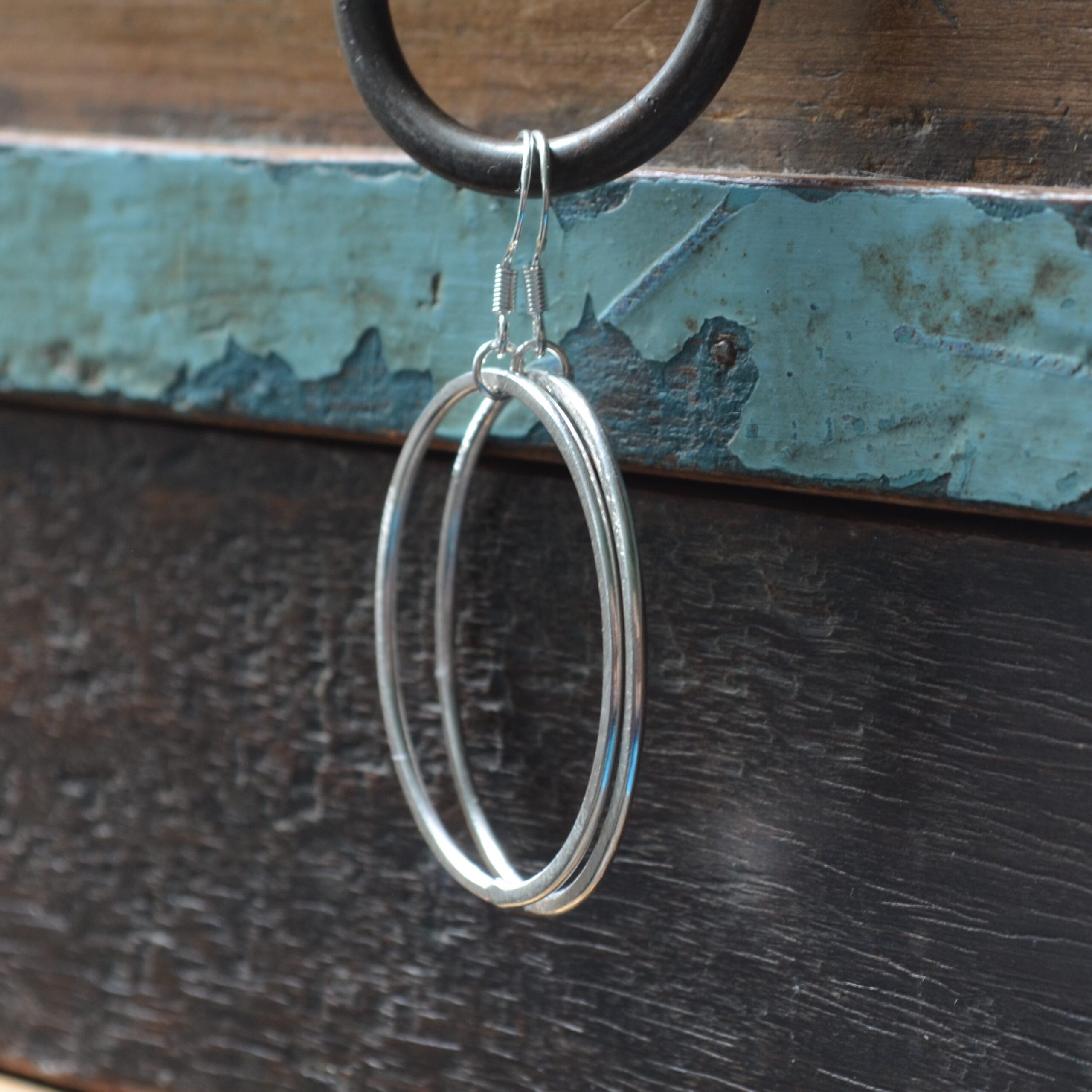 E178 Penny Hoop Earrings Medium. Fine silver, large statement hoops hanging from sterling silver ear hooks. Handmade, Fair Trade