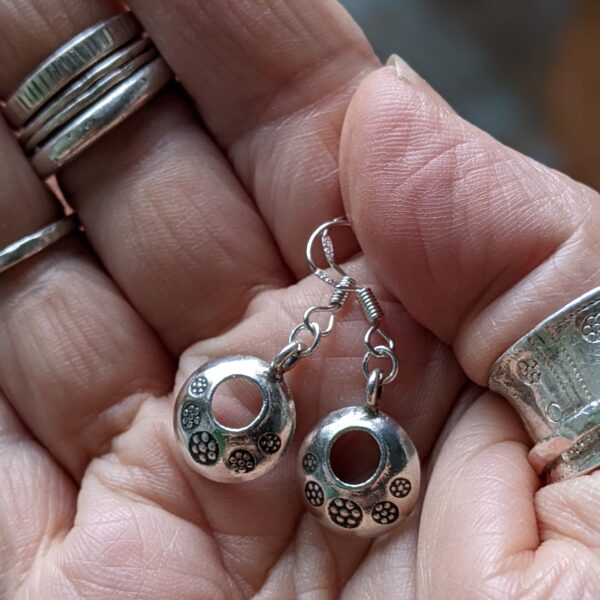E187 Indi Earrings. The Indi Earrings are small, curved doughnut shaped earrings. They have striking oxidised stamped details. Fair Trade, Handmade, Fine Silver