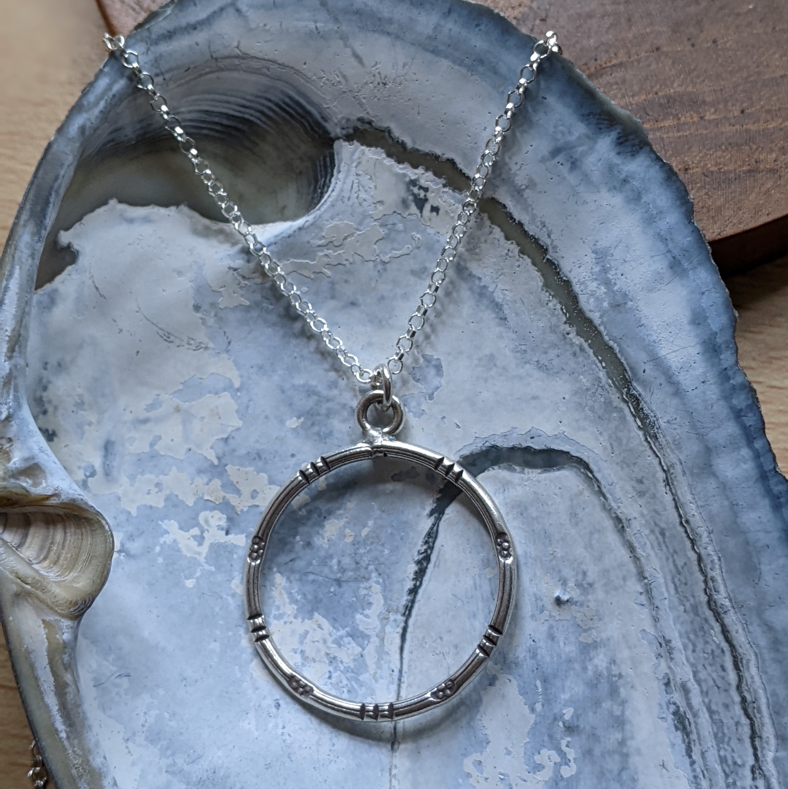 P101 Esther Pendant. Tribal feel statement pendant. A silver ring with tribal oxidised stamping. Wear on a cord necklace or a recycled silver chain
