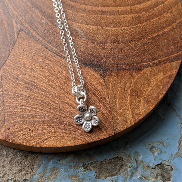 P209 Minka Flower Pendant. Chose a sterling silver chain, cord necklace or just the pendant. Flower shaped fine silver pendant.