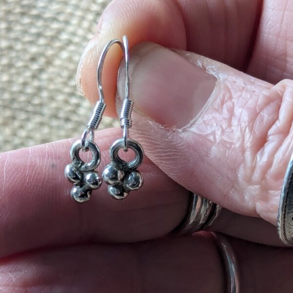 E194 Celeste Earrings. Tiny dangle drop cluster of silver balls. Handcrafted and Fair Trade. Hanging on sterling silver ear hooks