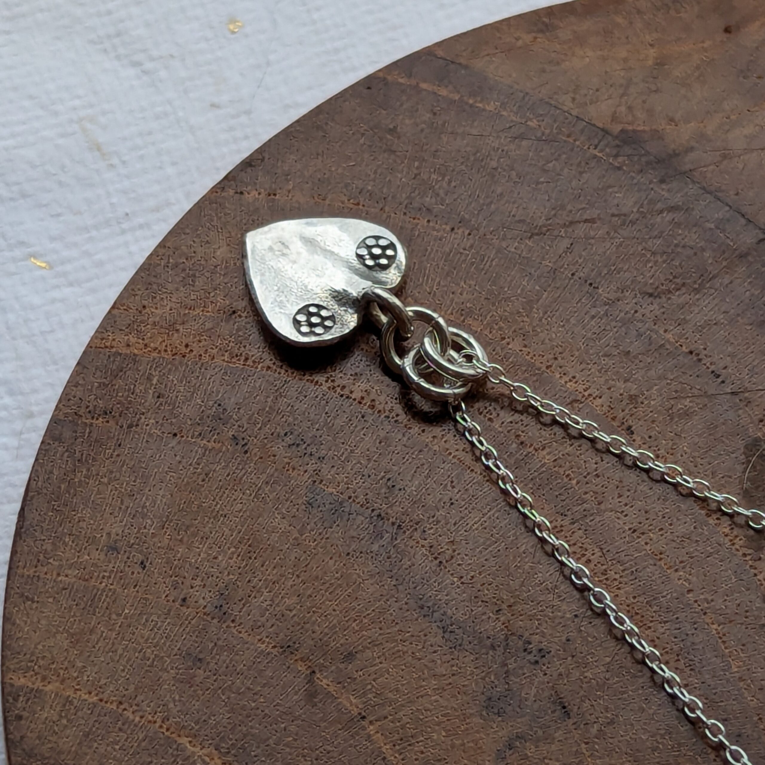 P118 Margo Heart Pendant. A small recycled fine silver heart. Ethically handmade and Fair Trade. Options to purchase on silver chain or strong cord.