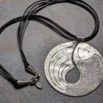 HL750 Mia Necklace. Disc fish shaped pendant. Statement necklace of handcrafted fine silver. Fair Trade and ethically made.