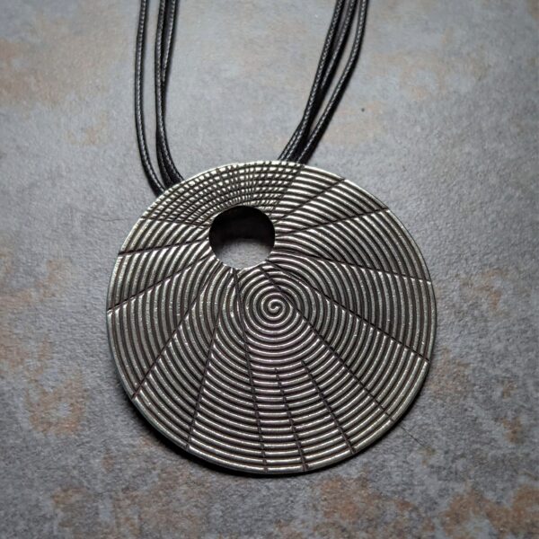 HL752 Juno Pendant Necklace. Statement necklace with a fine silver disc pendant with oxidised spiral patterning. Fair Trade, ethically made.