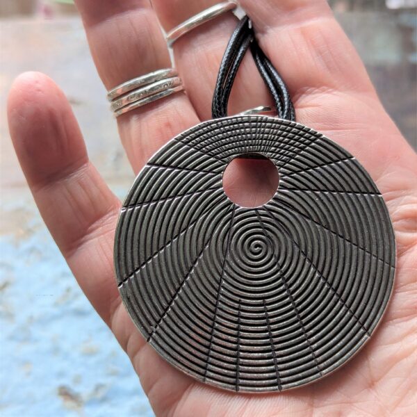 HL752 Juno Pendant Necklace. Statement necklace with a fine silver disc pendant with oxidised spiral patterning. Fair Trade, ethically made.