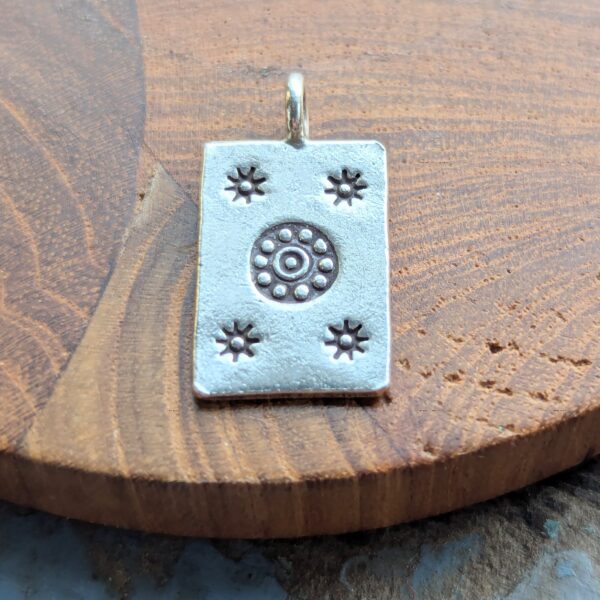 P044 Josie Pendant. Rectangular pendant with oxidised star and flower stamping. Ethically handmade from recycled fine silver. Fair Trade. A choice of necklaces is available.