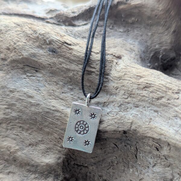 P044 Josie Pendant. Rectangular pendant with oxidised star and flower stamping. Ethically handmade from recycled fine silver. Fair Trade. A choice of necklaces is available.