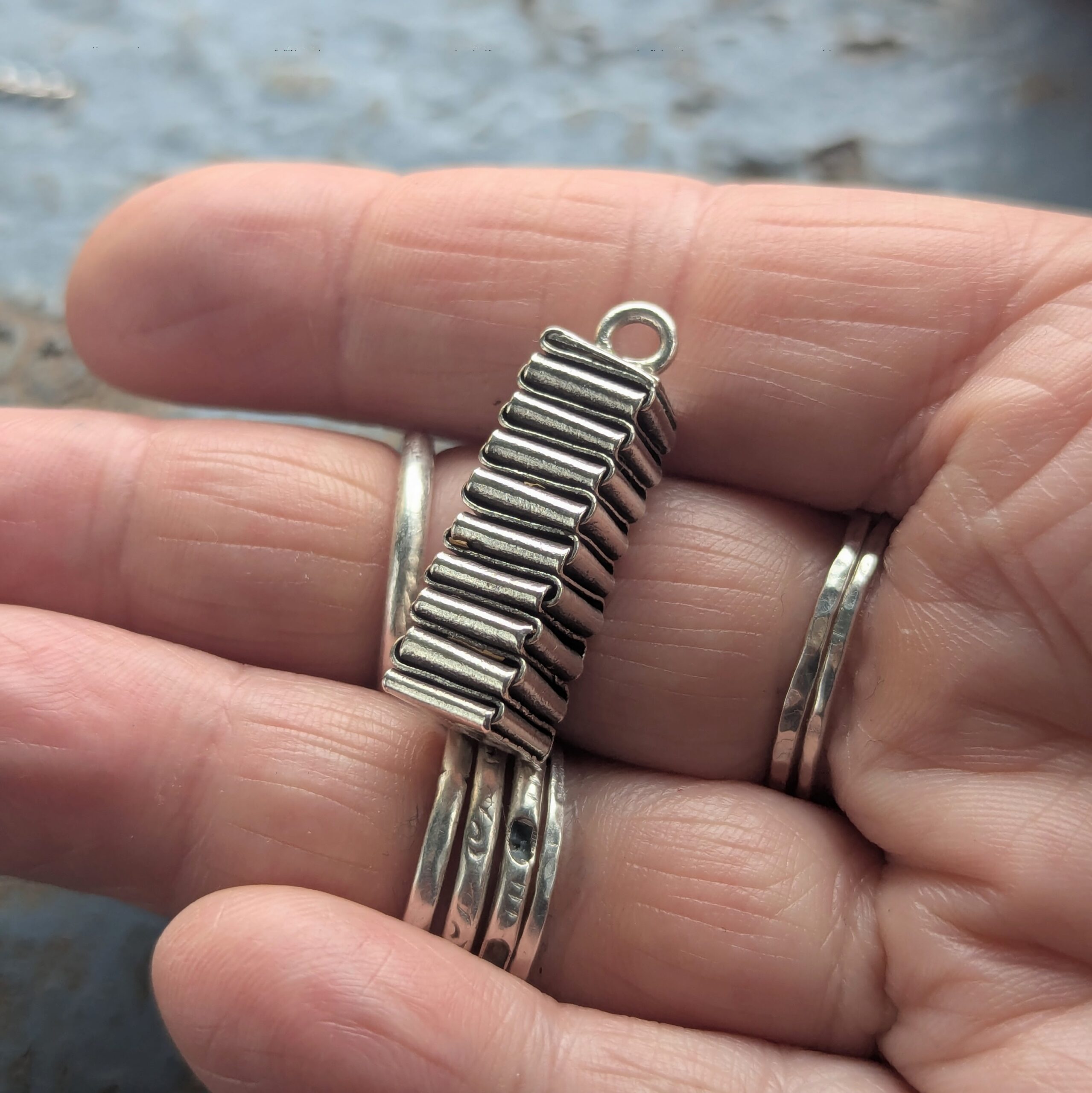 P097 Hope Pendant. A statement pendant created by the craft of origami with folded fine silver. Ethically handcrafted from recycled fine silver. Fair Trade. A choice of necklaces are available