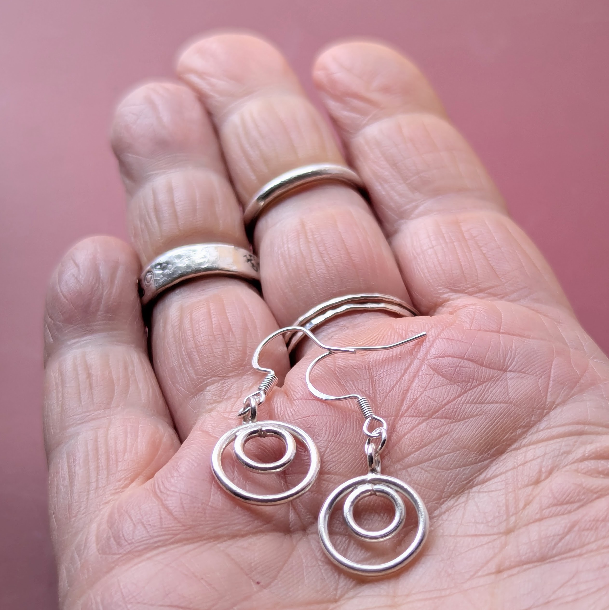 E206 Tamara Earrings. Double hoop dangle drops. Handmade from recycled fine silver and Fair Trade.