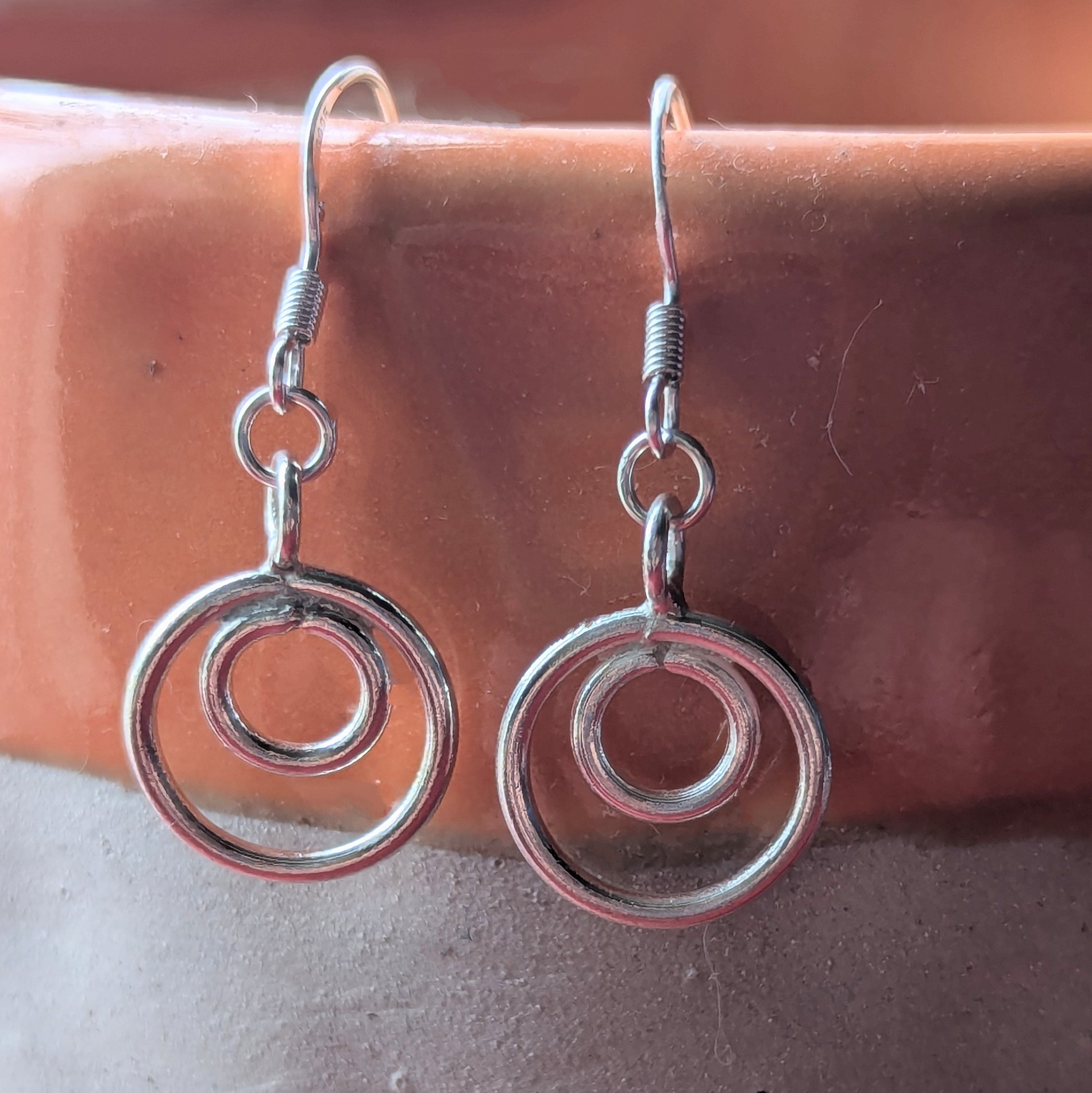 E206 Tamara Earrings. Double hoop dangle drops. Handmade from recycled fine silver and Fair Trade.