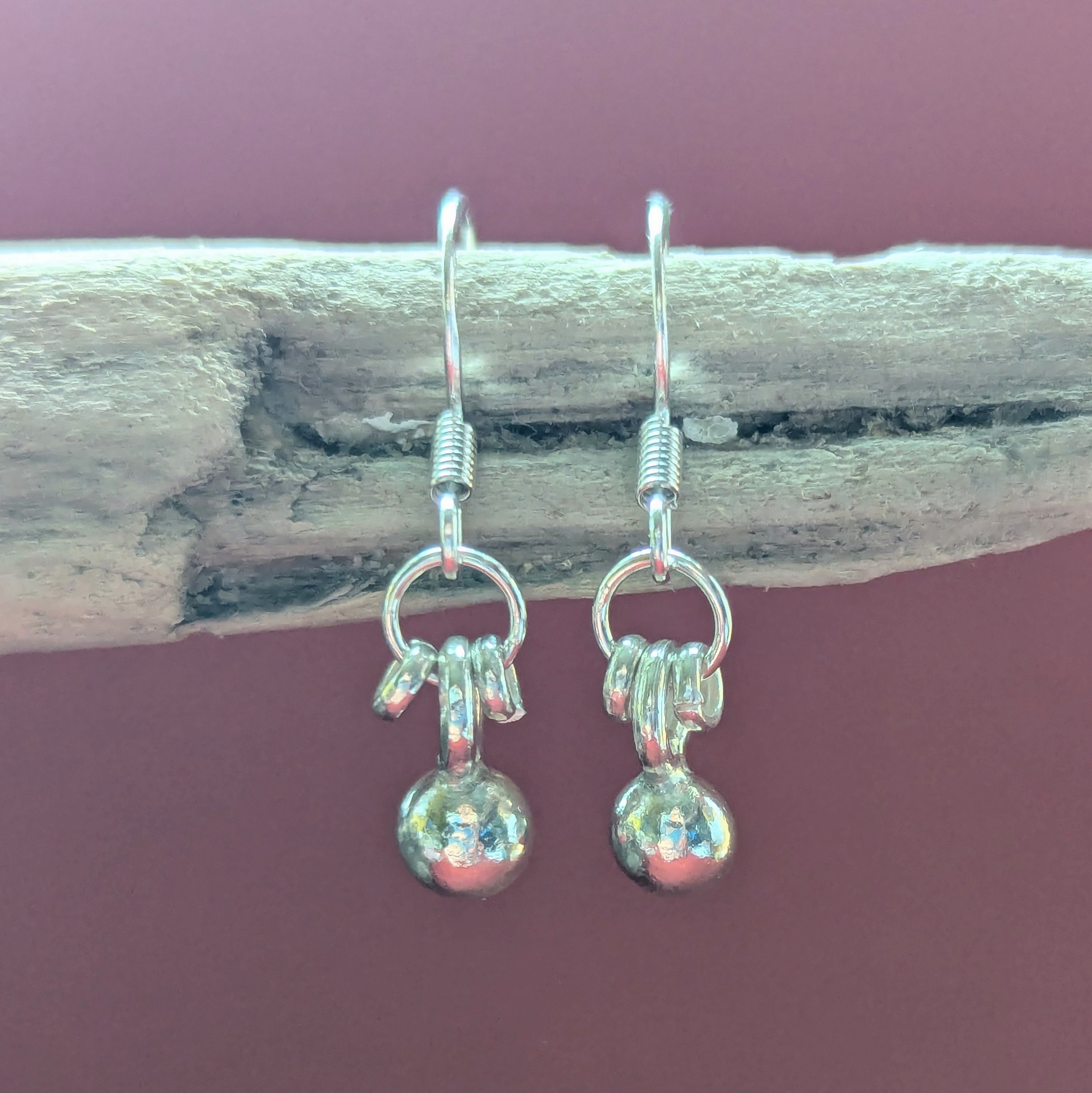 E207 Adriana Earrings. Tiny dangle drop ball earrings. Spiral dangle drops. Handmade from recycled fine silver and Fair Trade.