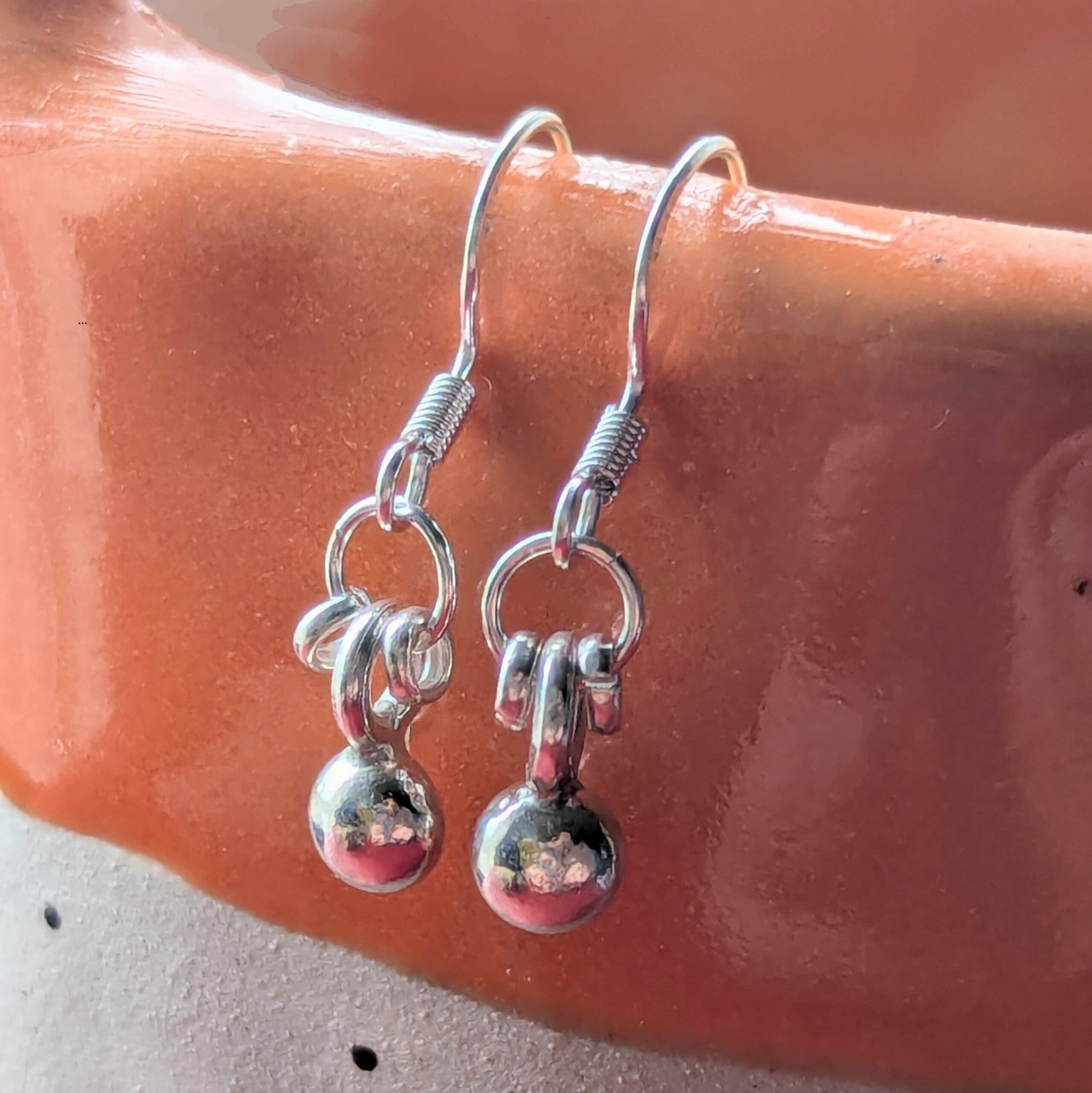 E207 Adriana Earrings. Tiny dangle drop ball earrings. Spiral dangle drops. Handmade from recycled fine silver and Fair Trade.