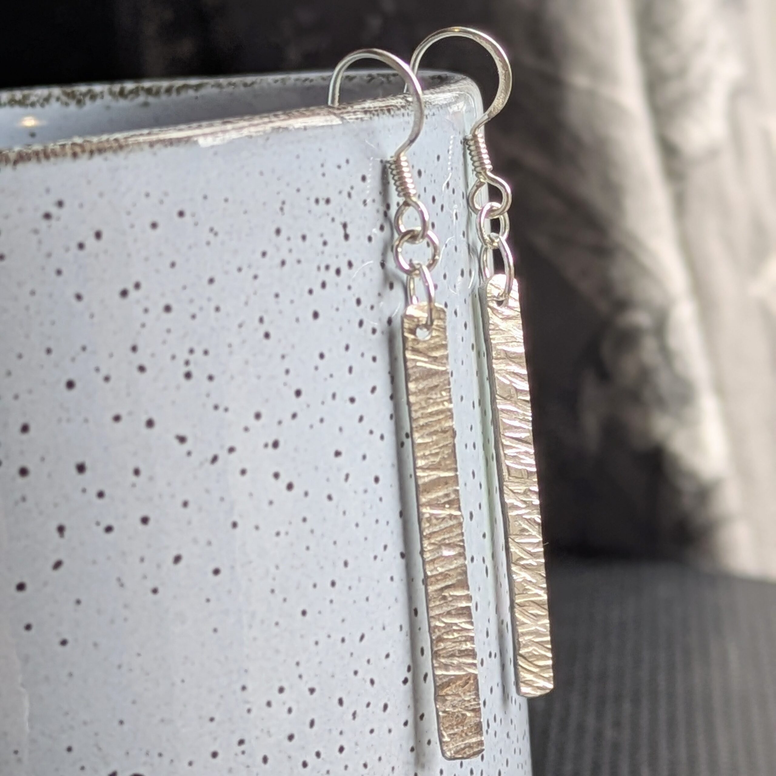 E220 Bronte Earrings. Long elegant rectangular dangle drop earrings. Created from recycled silver and made in Cheshire, UK