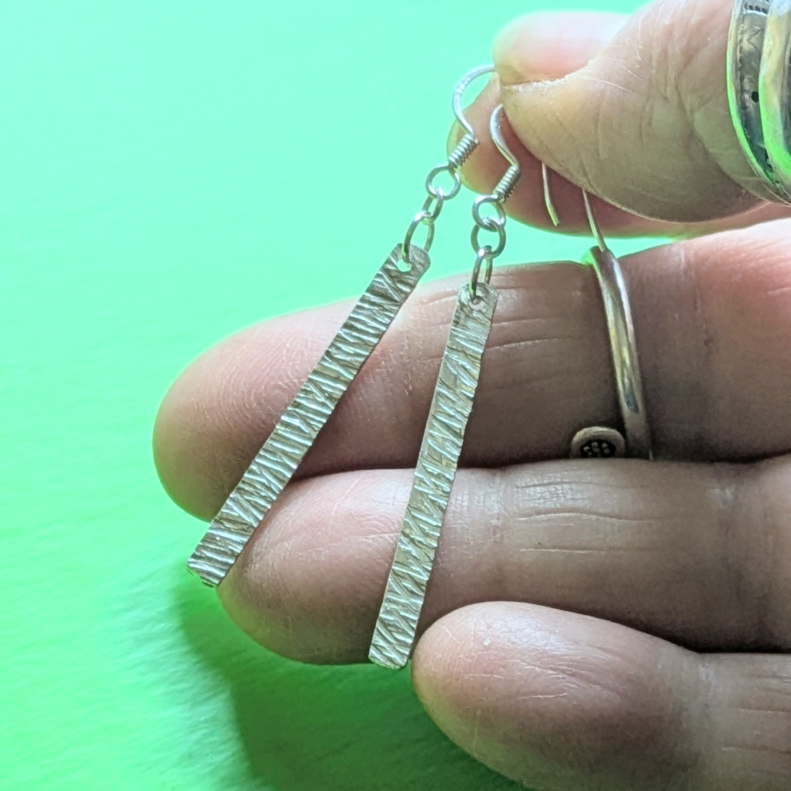 E220 Bronte Earrings. Long elegant rectangular dangle drop earrings. Created from recycled silver and made in Cheshire, UK