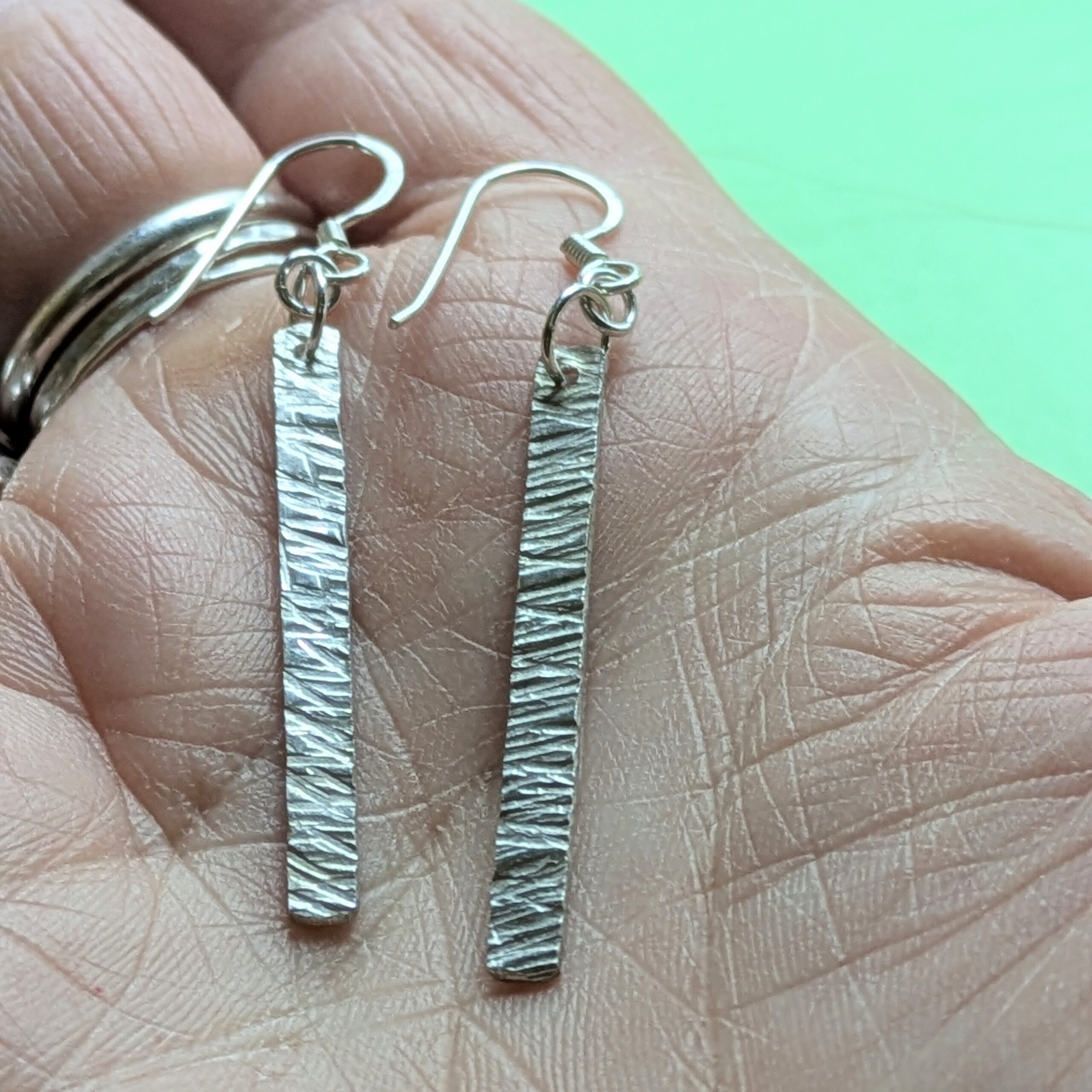 E220 Bronte Earrings. Long elegant rectangular dangle drop earrings. Created from recycled silver and made in Cheshire, UK