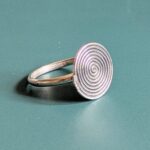 R069 Rune Ring. A statement spiral disc ring. Handcrafted from recycled fine silver. Fair Trade.