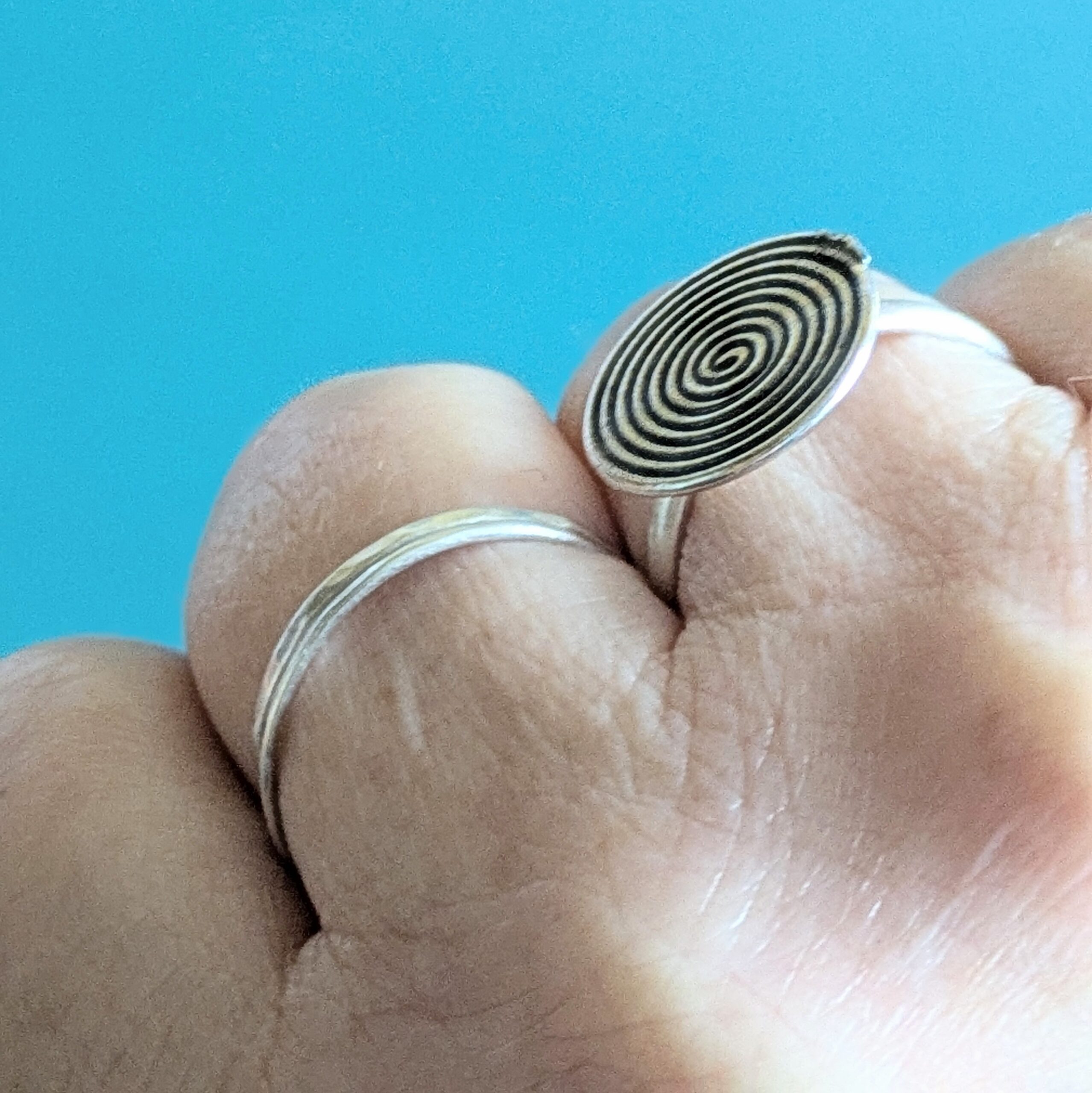 R069 Rune Ring. A statement spiral disc ring. Handcrafted from recycled fine silver. Fair Trade.