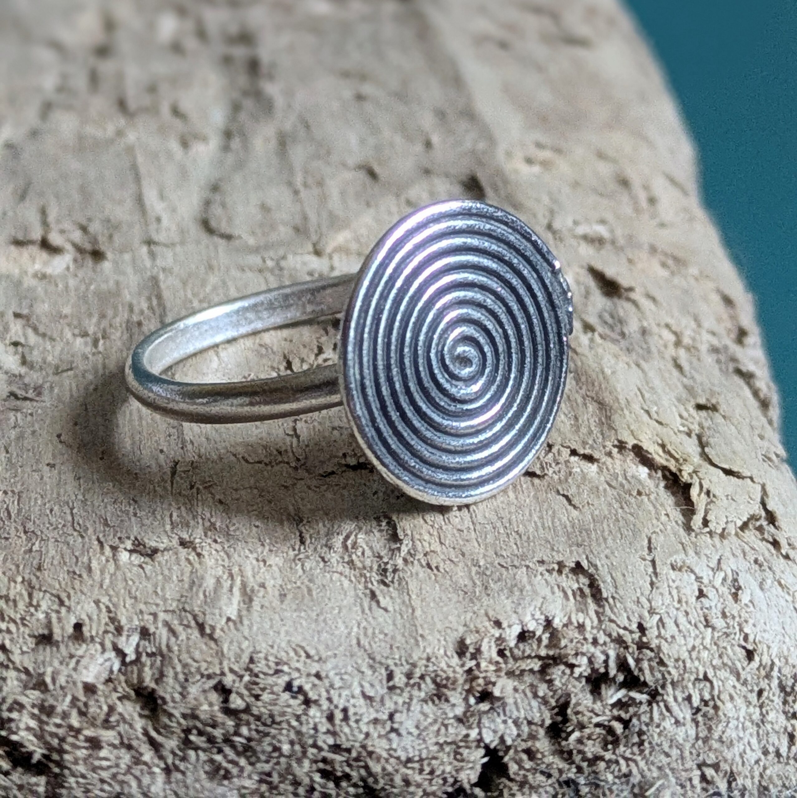 R069 Rune Ring. A statement spiral disc ring. Handcrafted from recycled fine silver. Fair Trade.