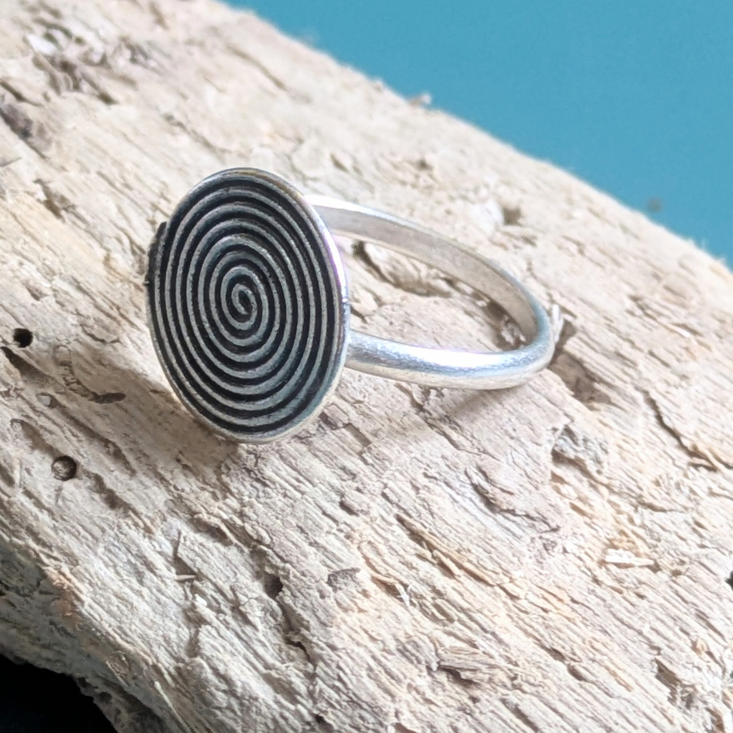 R069 Rune Ring. A statement spiral disc ring. Handcrafted from recycled fine silver. Fair Trade.