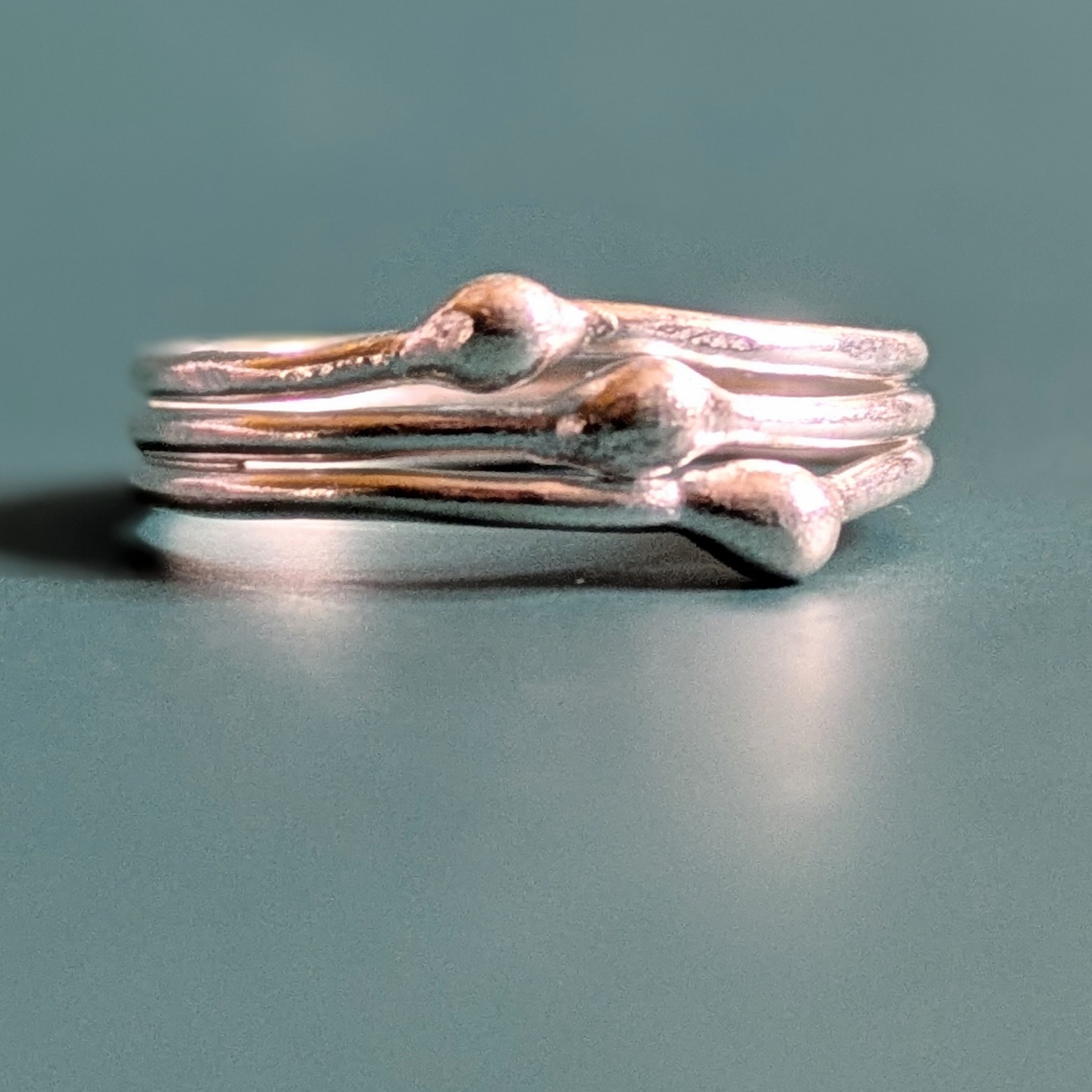 R071 Robbie Ring. A triple band ring with central detailing. Fine silver. Fair Trade