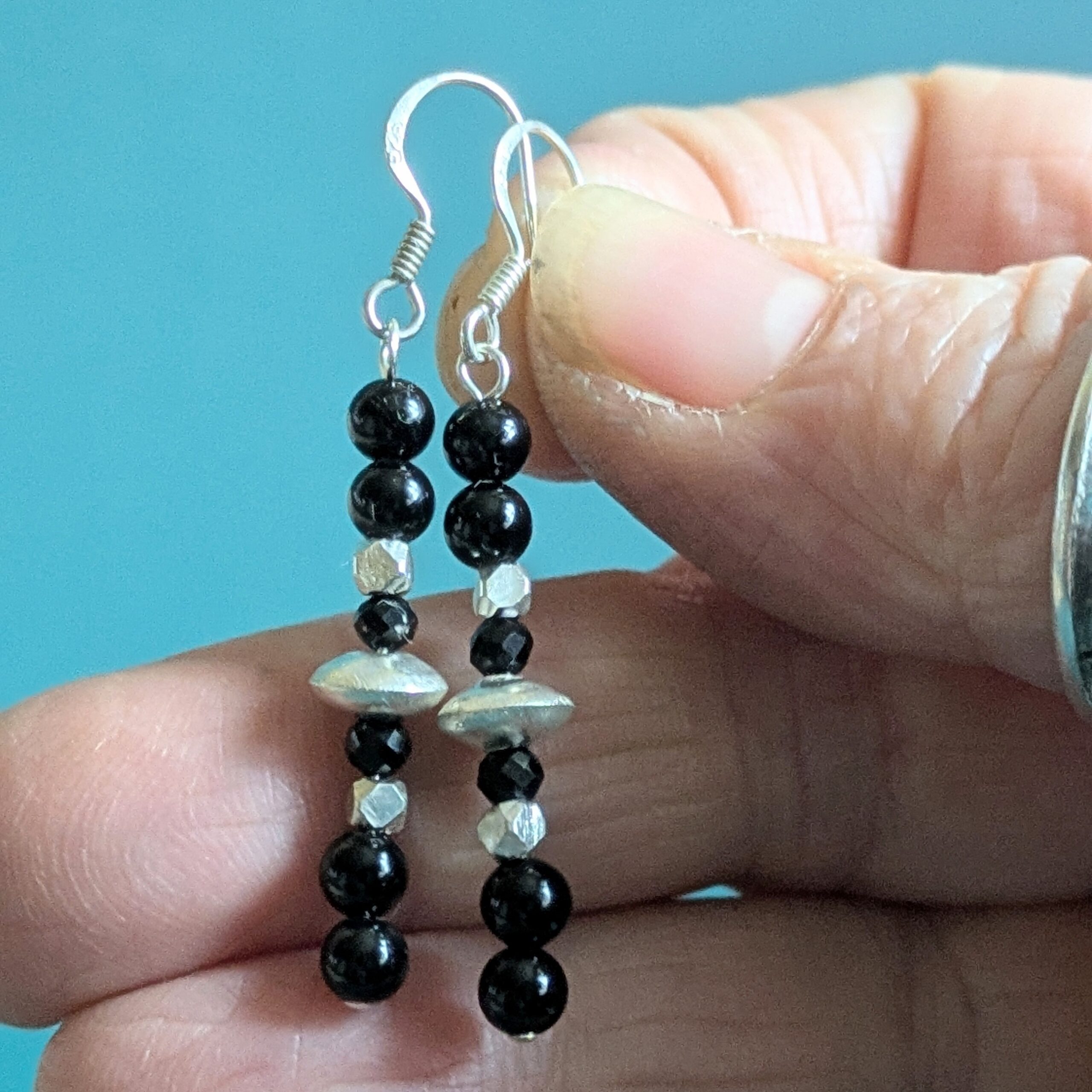 E225 Twilight Earrings - Dangle drop earrings of black onyx and Fair Trade silver beads. Handcrafted in Thailand and the UK.